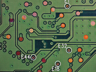 Green printed circuit board PCB hard drive. Fragment of printed wiring board PWB close up. Conductive pattern. IT&C. Background or wallpaper for theme computer hardware and equipment. Strong macro