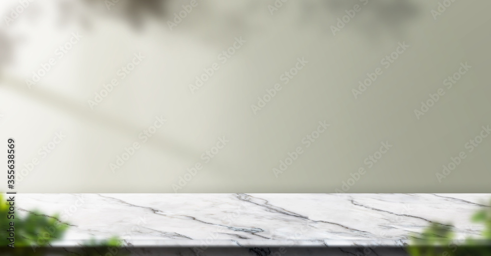 Aufkleber marble table background with sunlight window create leaf shadow on wall with blur indoor green plant
