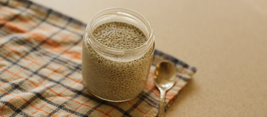 Dessert bowl of tasty chia seed pudding on white background
