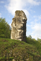 Maczuga Herkulesa monadnock near Pieskowa Skala (Little Dog's Rock) castle at Ojcow National Park. Poland - obrazy, fototapety, plakaty