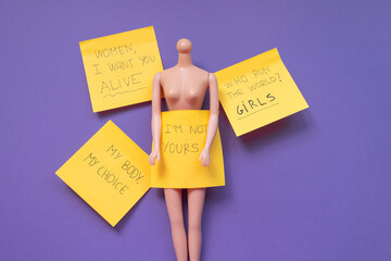 Plastic mannequin doll with copy space on a purple background. Feminism concept. Equality