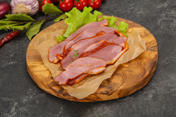 Sliced smoked duck breast served salad