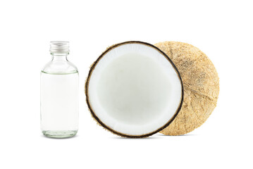 Cold pressed coconut oil in bottle with fresh coconuts on white background