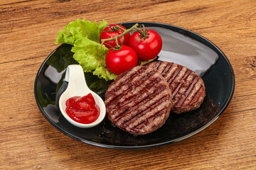 Grilled burger cutlet with sauce