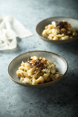 Traditional German noodles with cheese and fried onion