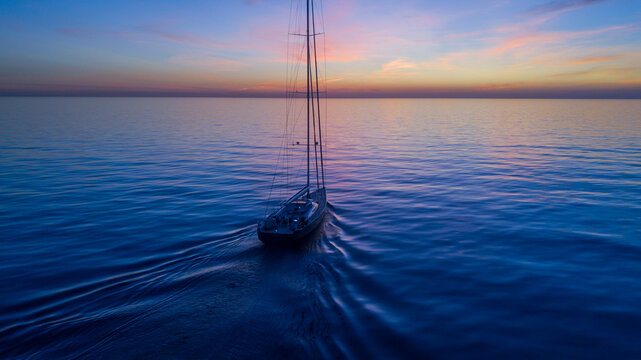 Superyacht sailing boat sunset over the sea 6