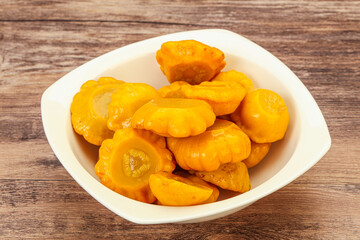 Marinated yellow patisson in the bowl