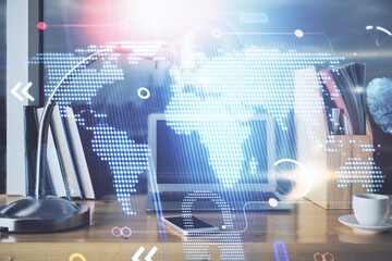 Multi exposure of table with computer and world map hologram. International data network concept.