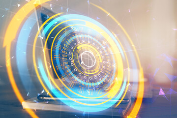 Computer on desktop in office with technology theme hologram. Multi exposure. Tech concept.