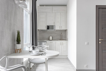 White Scandinavian modern living room with dining area and small kitchen 0063