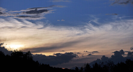 The sun has set in clouds - a sign of worsening weather. Spring in the Western Urals.