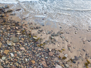 Small rocks on the beach coastline.