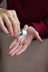 Senior womanUsd Alcohol Gel Cleaning Her Hands For Prevent A Covid19 Virus