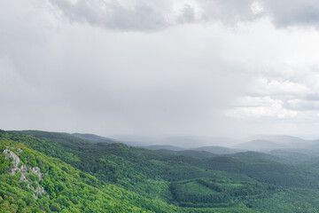 Cloudy mountains and rain gathering over the Bükk mountains. View from Tar kő, one of the highest peaks of the Bükk mountains near Miiskolc, Hungary.