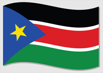 Waving flag of South Sudan vector graphic. Waving South Sudanese flag illustration. South Sudan country flag wavin in the wind is a symbol of freedom and independence.