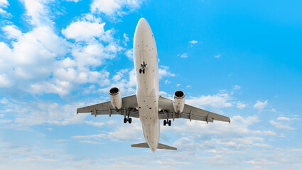 White Passenger plane fly up over take-off runway - White passenger airplane in the clouds  - Travel by air transport