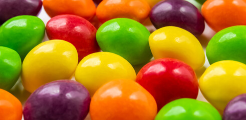 Group of multi-colored sweets on a white background