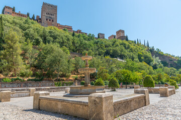 Alhambra palace viewed from Paseo de los Tristes in Granada, Spain