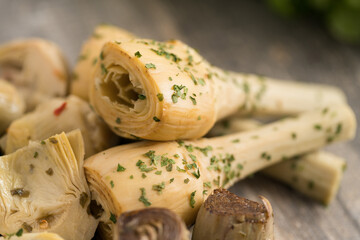 Stemmed artichokes and parsley. Preserves prepared at home as a side dish or appetizer typical of...