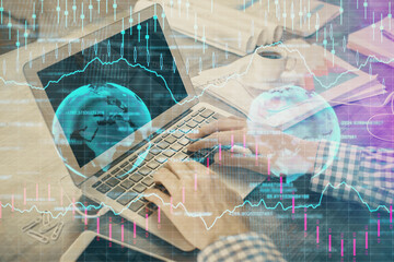 Double exposure of forex graph with man working on computer on background. Concept of market analysis.