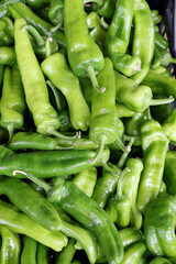 Closeup of sweet Italian green pepper friggitello on sale in a vegetable market