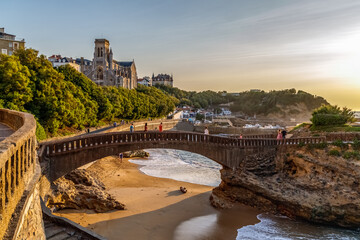 Biarritz, France. Panoramic view of the famous stone bridge to the Rocher du Basta, cityscape and...