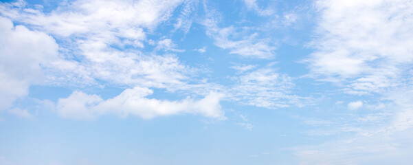 White clouds on the blue sky for background.