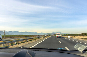 Fototapeta premium View from inside the car of the highway on the countryside of Chile