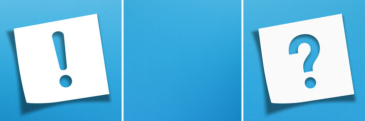 Note paper with exclamation mark and question mark on panoramic blue background
