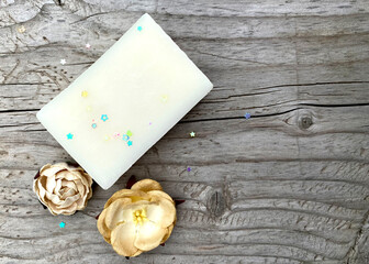 Handmade natural bath spa soap on vintage wooden background. Spa, skin care.