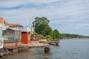 Houses with terraces and jetties on a lake