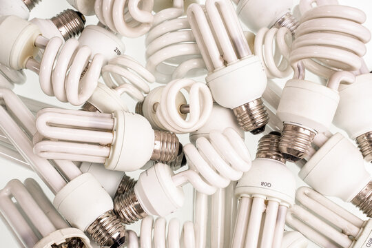 Spiral Energy Saving Fluorescent Electric Light Bulbs. Old Burnt Lamps