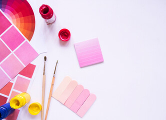 Top view of colorful paint with a brush.