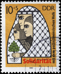 Solidarity for the Palestinian cause on old stamp of DDR
