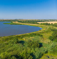 Fototapeta na wymiar Beautiful countryside landscape with a pond, aerial view. Russia