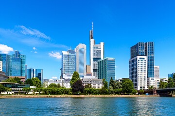 Beautiful view on  Frankfurt am Main skyline cityscape with blue sky, clouds, Main river in spring. Hessen, Hesse, Germany