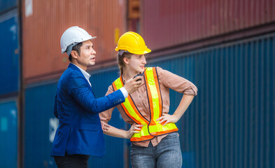 Engineer and foreman worker team checking containers box from cargo, Logistic and teamwork concept