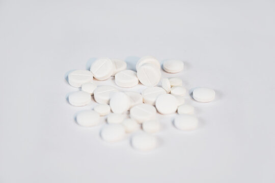white pills isolated on white background