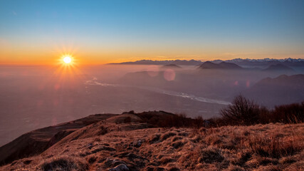 Winter sunset from an alpine peak of Friuli-Venezia Giulia