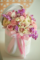Bouquet of flowers in a white box. Bouquet of delicate flowers. Very beautiful flowers for a postcard.