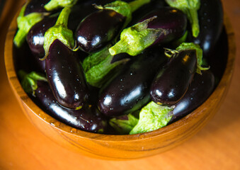 Ripe blackberry in a wooden bowl