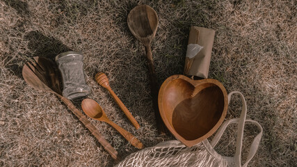 Eco-friendly packaging, dishes, shopping bag. Reusable wooden utensils. View from above