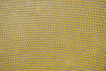 Yellow mosaic tile background. Texture square small ceramic tiles