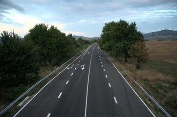 Empty Asphalt Road in Bulgaria in the Autumn under a Clouded Sky