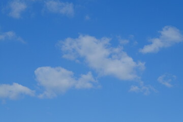A light blue sky with small  clouds. (La Baule)