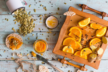 Orange jam and seeds on the wooden table 