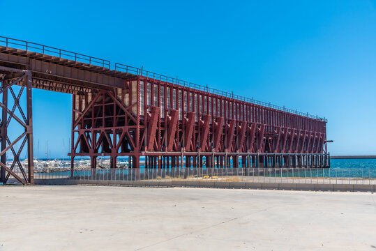 Historical railway used for transport of minerals on cargo ships in Almeria, Spain