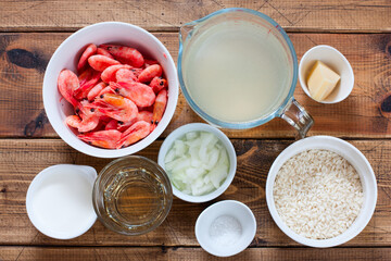 Step-by-step preparation of shrimp risotto, step 1 - preparation of the necessary ingredients, top view, selective focus