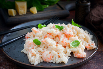 Shrimp risotto with cream sauce, selective focus