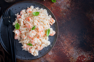 Shrimp risotto with cream sauce, selective focus